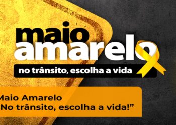 Campanha Maio Amarelo com laço amarelo e mensagem "No trânsito, escolha a vida" para conscientização sobre segurança no trânsito